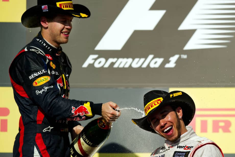 Hamilton (der.) celebra con Vettel su triunfo en el G. P. de Estados Unidos. / AFP