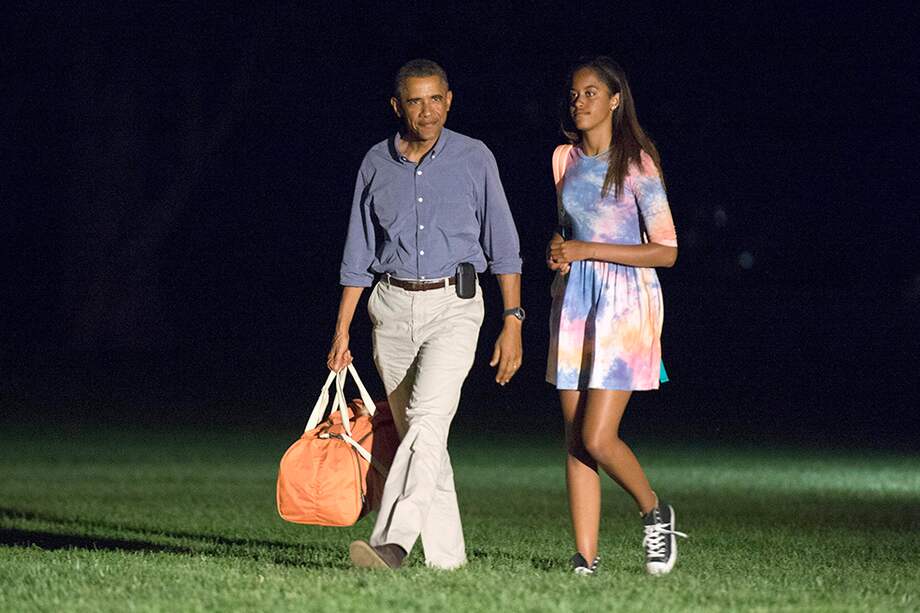 Barack Obama y su hija Malia en 2014. / Archivo AFP