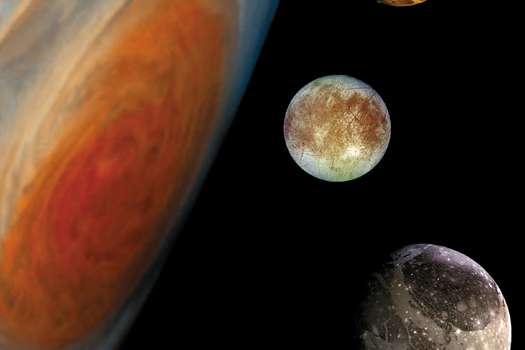 Júpiter junto a tres de sus lunas. 