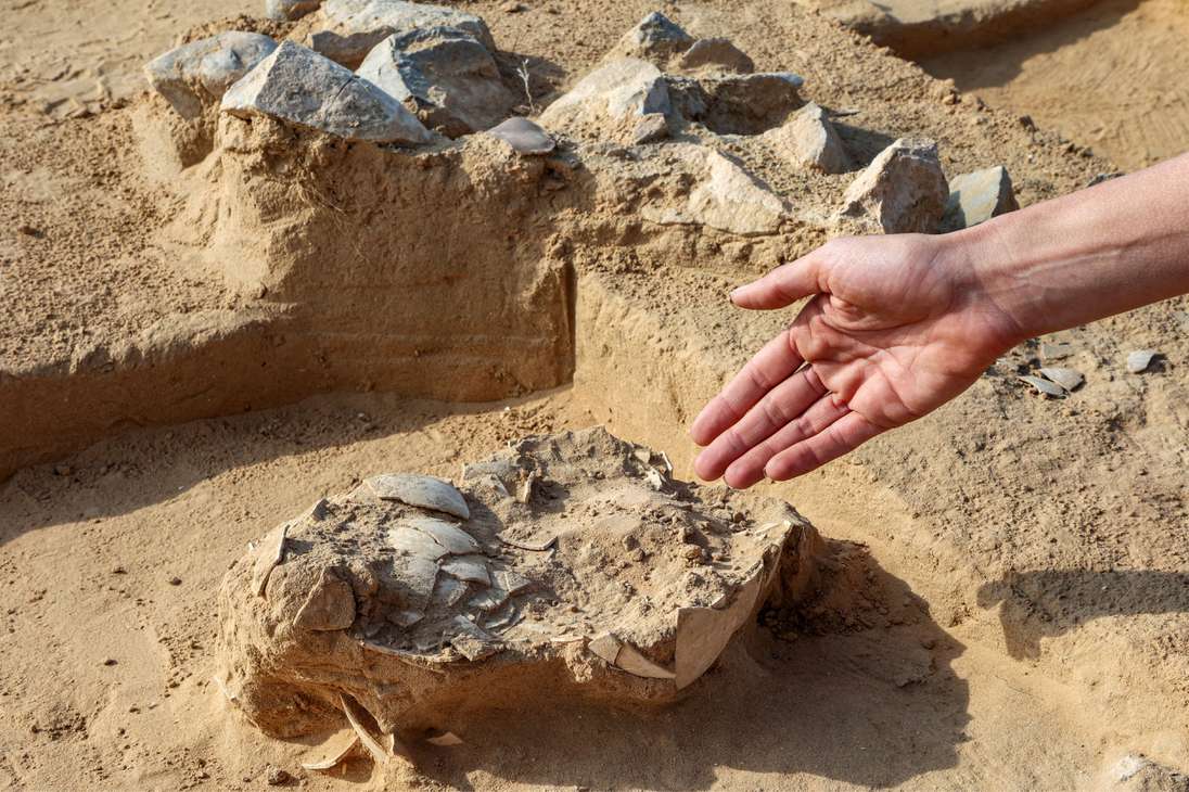 This picture taken on January 12, 2023 shows a view of discovered ostrich egg fragments dating over 4000 years discovered by the Israel Antiquities Authority (IAA) at a site in the dunes near Nitzana along the Israel-Egypt border in the western Negev desert. - Experts say the finds provide insight into the life of the ancient peoples inhabiting the region. The eight crushed eggs were located at a camp site used by nomads "since prehistoric times," said Lauren Davis, the Israel Antiquities Authority excavation director. Their proximity to the fire, alongside stones, flint, tools and pottery sherds, implies that the eggs were to be cooked, said Davis. (Photo by GIL COHEN-MAGEN / AFP)