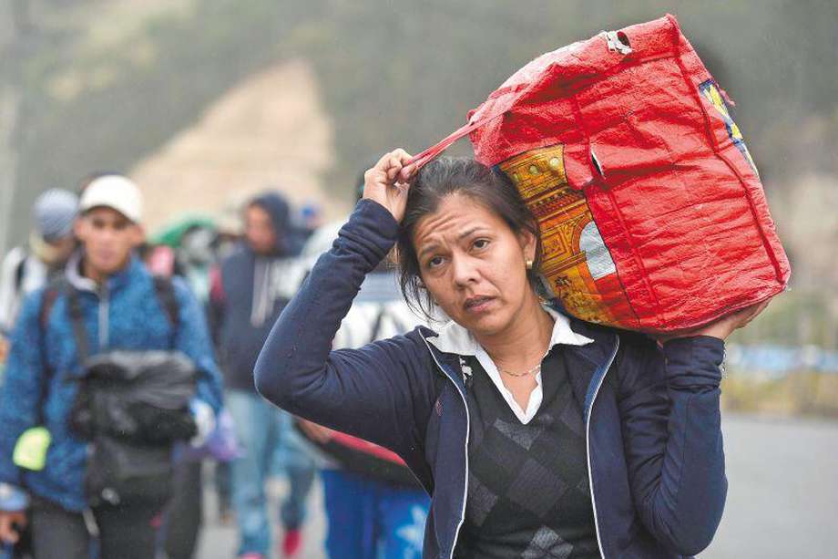 El 51 % de los migrantes venezolanos en Colombia son mujeres. /AFP 
