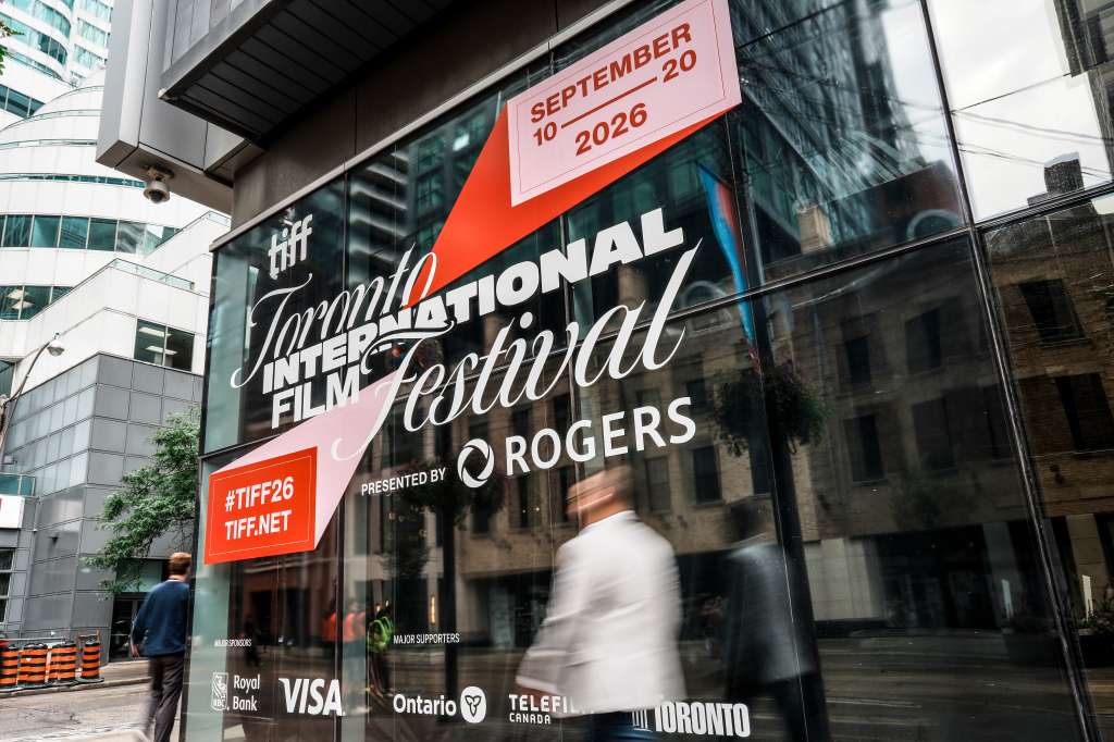 TORONTO, ONTARIO - SEPTEMBER 09: Members of the general public walk past signage posted at the TIFF Lightbox on King Street prior to the start of the 2026 Toronto International Film Festival on September 09, 2026 in Toronto, Ontario. (Photo by J. Countess/Getty Images)