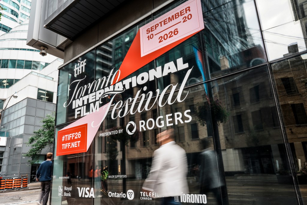 TORONTO, ONTARIO - SEPTEMBER 09: Members of the general public walk past signage posted at the TIFF Lightbox on King Street prior to the start of the 2026 Toronto International Film Festival on September 09, 2026 in Toronto, Ontario. (Photo by J. Countess/Getty Images)
