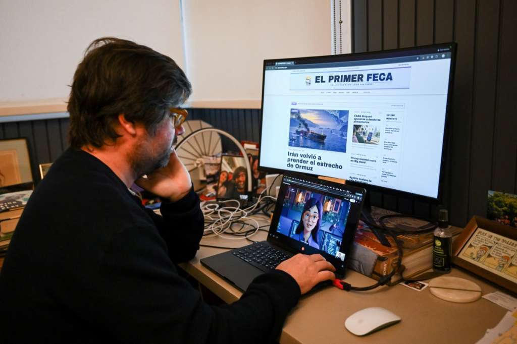 Santiago Siri, 42, an Argentine software developer and creator of "El Primer Feca" ("coffee" spelled backwards), an Argentine news outlet produced entirely by artificial intelligence using journalist avatars, shows the platform during an interview with AFP in Buenos Aires on September 18, 2026.
