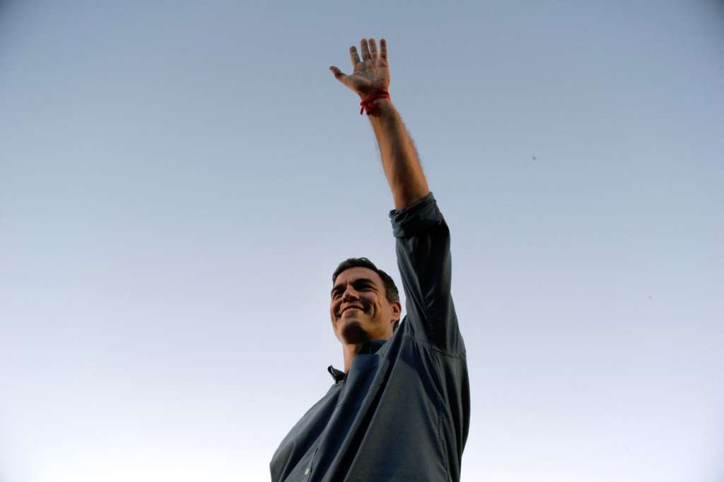 (FILES) Candidate for Secretary General of the Spanish Socialist Party (PSOE), Pedro Sanchez, waves during a political meeting with supporters at the Muelle de la Sal in Sevilla on May 19, 2017.
