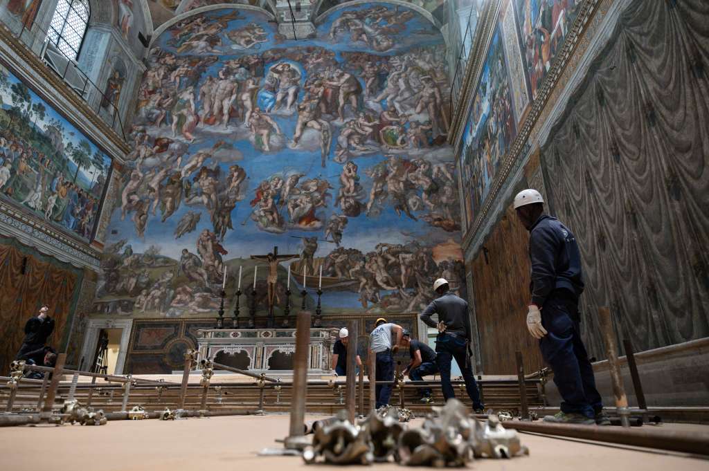 This photo handout on May 3, 2025 by The Vatican Media shows the setting up of the Sistine Chapel and installation of the chimney before the start of the conclave on May 7, 2025.  (Photo by Handout / VATICAN MEDIA / AFP) / RESTRICTED TO EDITORIAL USE - MANDATORY CREDIT "AFP PHOTO / VATICAN MEDIA" - NO MARKETING - NO ADVERTISING CAMPAIGNS - DISTRIBUTED AS A SERVICE TO CLIENTS