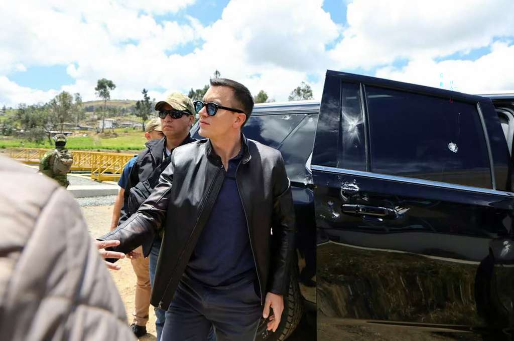 This handout picture released by the Ecuadorian Presidency shows Ecuador's President Daniel Noboa next to one of the vehicles in the motorcade he was traveling in when it was attacked by gunfire in Cañar, Ecuador, on October 7, 2025.