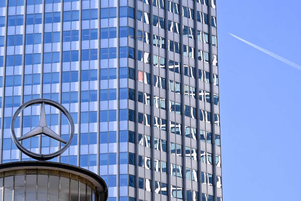 A giant logo of German automotive brand Mercedes-Benz is pictured atop a building in Frankfurt am Main, western Germany, on April 29, 2025.
