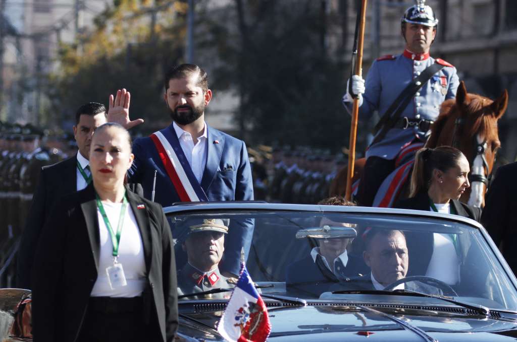 Chile's President Gabriel Boric waves as he leaves after giving his "State of the Nation" annual message to the country at the Congress in Valparaiso, Chile, on June 1, 2024. (Photo by FRANCESCO DEGASPERI / AFP)