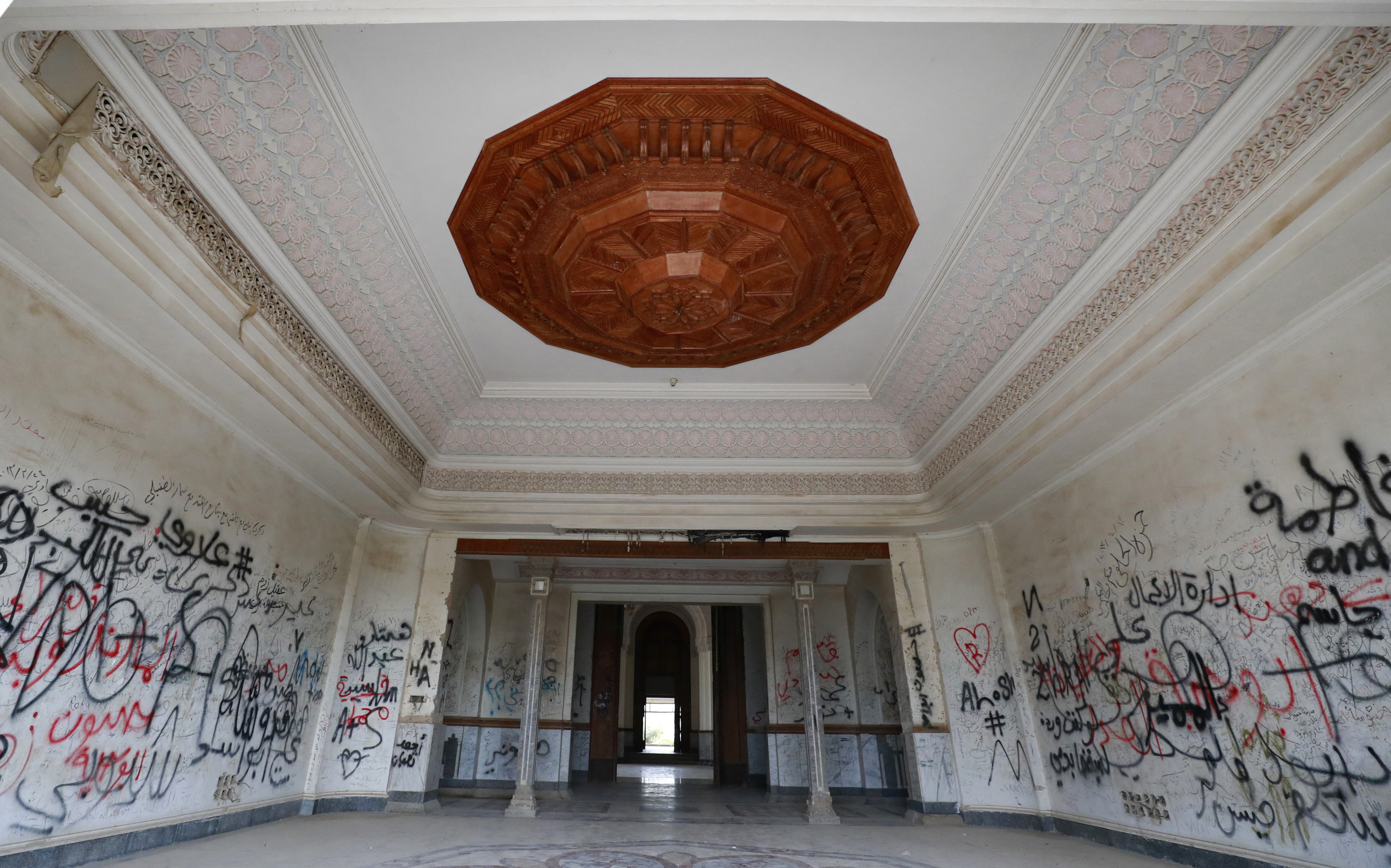 A picture shows one of former Iraqi dictator Saddam Hussein's palaces in the Babylon Tourist Resort in the Babil Governorate in central Iraq on January 17, 2022. - Scattered across Iraq lie more than 100 opulent palaces and villas built by former dictator Saddam Hussein -- some in use, many in ruins like much of the war-scarred country. With their marble columns, ornate carvings and gaudy furniture, they reflected the delusions of grandeur and the megalomania of Saddam, who visited some of them only once or twice. (Photo by AHMAD AL-RUBAYE / AFP)