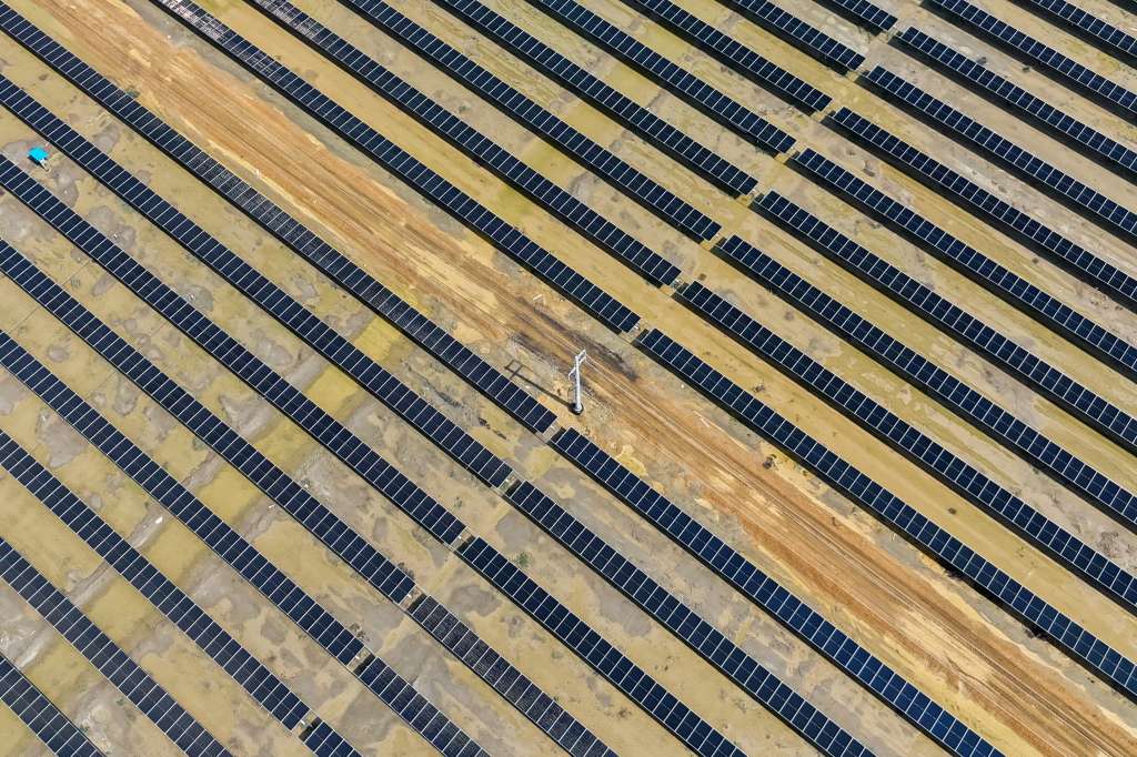 (FILES) This aerial photograph taken on October 15, 2024, shows solar panels installed at the Adani Green Renewable Energy Plant in Khavda, in India's Gujarat state.