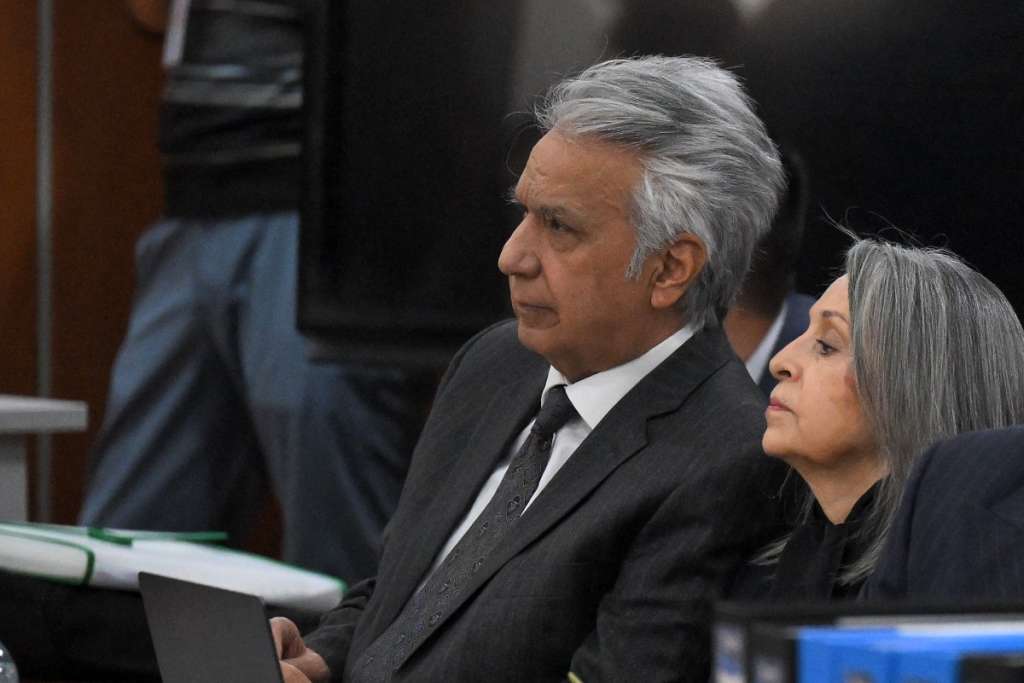 (FILES) Ecuador's former President (2017-2021) Lenin Moreno (L) appears at the National Court of Justice over a corruption case next to his wife Rocio Gonzalez (R) in Quito, on May 11, 2026.