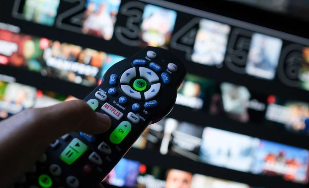 (FILES) In this illustration photo taken on July 19, 2022 the Netflix logo is seen on a TV remote in Los Angeles.