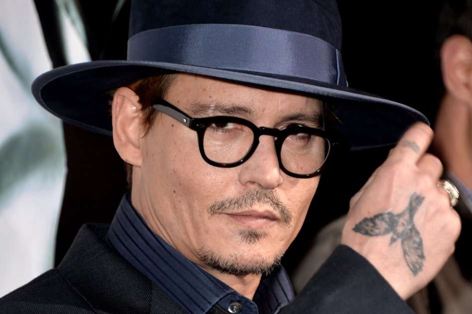 Durante su gira en Rusia, el actor y músico Johnny Depp se vio, según sus fans, con gran deterioro físico.  / AFP