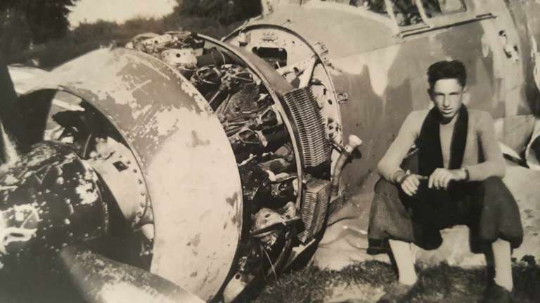 CORRECTION / This handout picture taken in 1940, courtesy of Caillet's family, shows World War II French Resistance fighter Jean Caillet posing next to the wreckage of a French Bloch MB 152 fighter aircraft in Nesle-Hodeng, France.