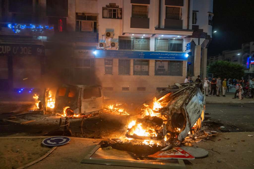 Sale (Morocco), 01/10/2025.- A police car burns as youth-led protests demanding health care and education reforms turns violent, in Sale, Morocco, 01 October 2025. (Protestas, Marruecos) EFE/EPA/Jalal Morchidi