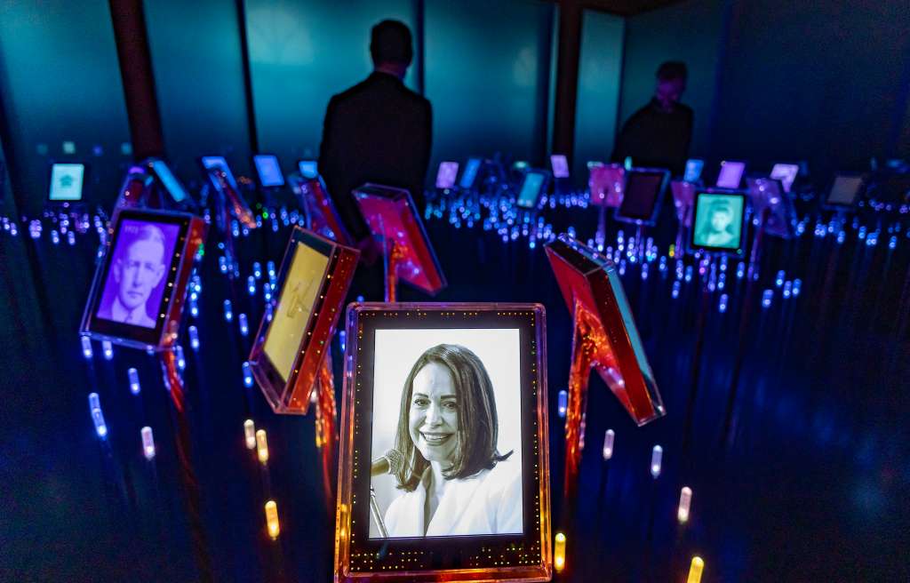 A picture of Nobel Peace Prize laureate Maria Corina Machado is seen among portraits of previous winners in the "Nobel Field" at the exhibition "Democracy on the brink" in honour of the laureate at the Nobel Peace Center in Oslo on December 9, 2025, on the eve of the Nobel Peace Prize ceremony. The new exhibition featuring the 2025 laureate opens to the public on December 12, 2024. (Photo by Odd ANDERSEN / AFP)