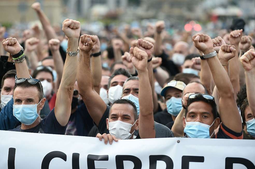 Nissan employees shout slogans during a demonstration against the closure of the Japanese carmaker's factory in Barcelona on June 11, 2020. Japanese carmaker Nissan has decided to shut its factory in Barcelona where 3,000 people are employed after four decades of operations.
