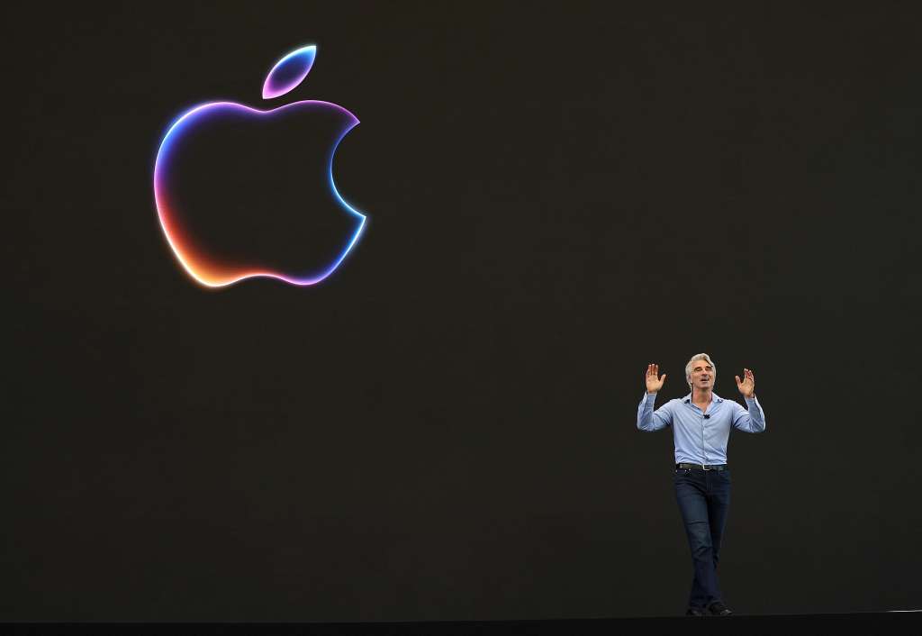 (FILES) Apple senior vice president of software engineering Craig Federighi speaks at the start of the Apple Worldwide Developers Conference (WWDC) on June 10, 2024 in Cupertino, California. Apple will announce plans to incorporate artificial intelligence (AI) into Apple software and hardware.