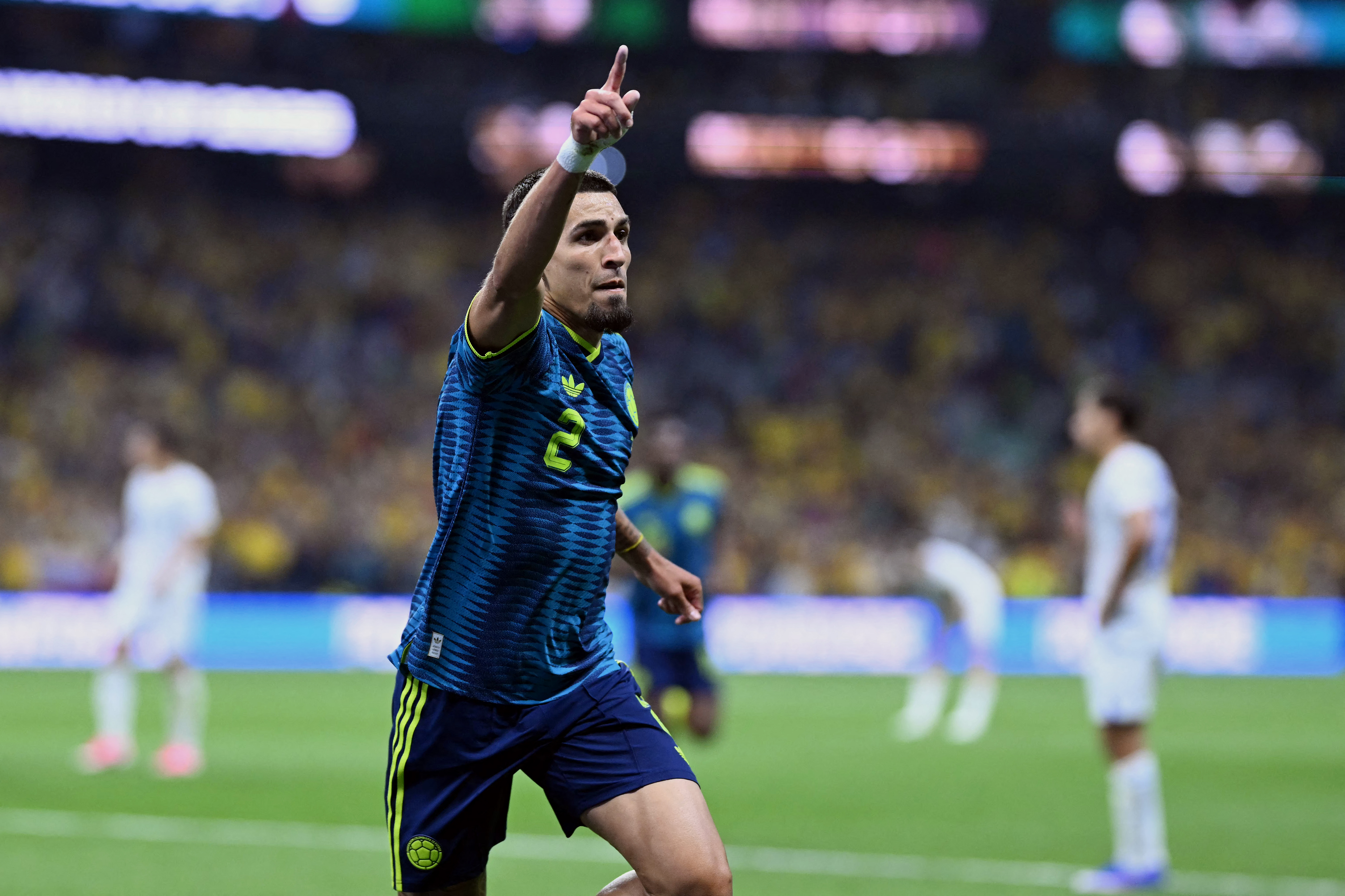 Colombia's defender #02 Daniel Munoz celebrates scoring his team's first goal during the 2026 World Cup Group K football match between Uzbekistan and Colombia at the Mexico City Stadium in Mexico City on June 17, 2026. (Photo by CARL DE SOUZA / AFP)