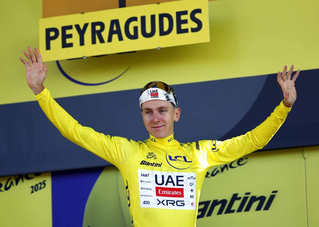 Peyragudes (France), 18/07/2025.- Slovenian rider Tadej Pogacar of UAE Team Emirates XRG celebrates on the podium in the overall leader yellow jersey after winning the 13th stage of the Tour de France cycling race, an Individual Time Trial (ITT) over 10.9km from Loudenvielle to Peyragudes, France, 18 July 2025. (Ciclismo, Francia) EFE/EPA/MARTIN DIVISEK