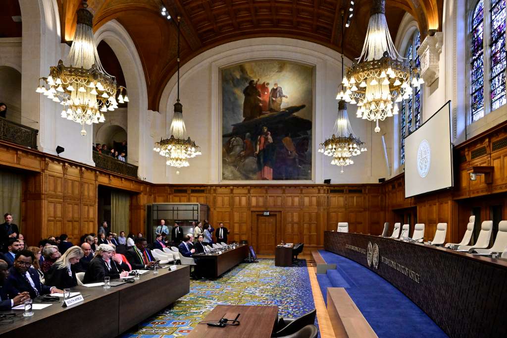 Members of the South Africa's legal team (L) attend a hearing at the International Court of Justice (ICJ) as part of South Africa's request on a Gaza ceasefire in The Hague, on May 24, 2024, amid the ongoing conflict between Israel and the Hamas movement.