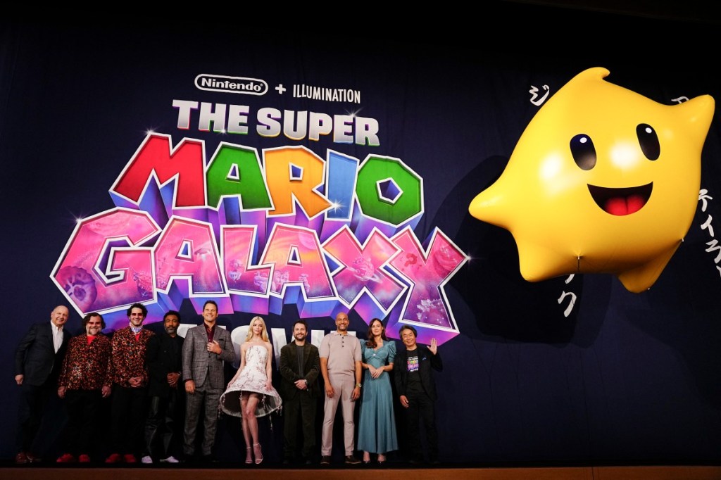 (FILES) (L-R) American actors Chris Meledandri, Jack Black, Benny Safdie, Donald Glover, Chris Pratt, Anya Taylor Joy, Charlie Day, Keegan-Michael Key, Brie Larson and Shigeru Miyamoto attend the world premiere of 'The Super Mario Galaxy Movie' at Minamiza Theater in Kyoto on March 28, 2026. The mustachioed brothers of "The Super Mario Galaxy Movie" and Ryan Gosling's unassuming teacher-turned-astronaut in "Project Hail Mary" are civilization-saving heroes in their own worlds. But cinema owners here on Earth also feel pretty grateful to them. The two films have drawn stellar audience figures in the last few weeks, pushing the US box office to its best start to the year since the Covid-19 pandemic. (Photo by Yuichi YAMAZAKI / AFP)