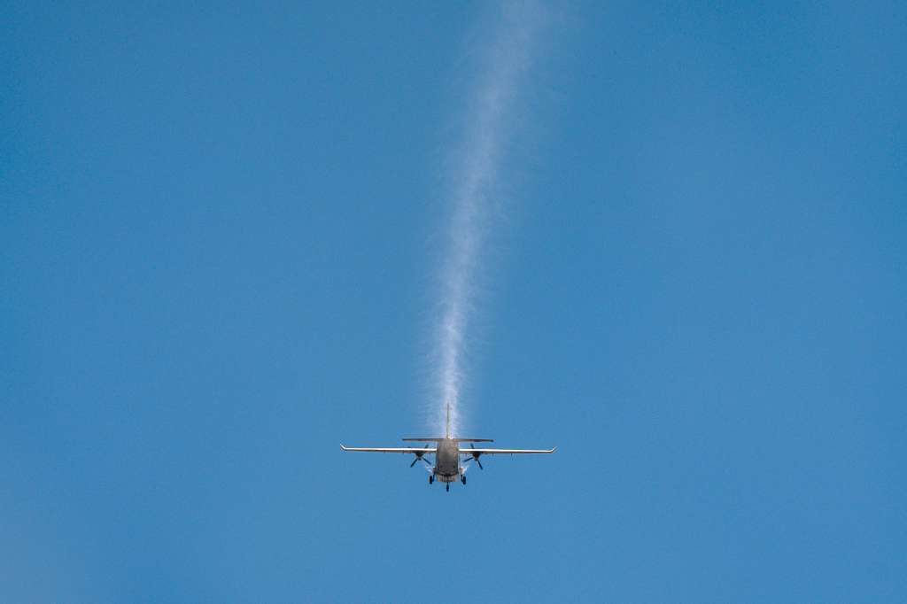 CORRECTION / This photo taken on January 15, 2025 shows an aircraft from Thailand's Royal Rainmaking department taking part in an atmospheric modification mission to displace pollution by spraying icy water in the air on the outskirts of Bangkok.