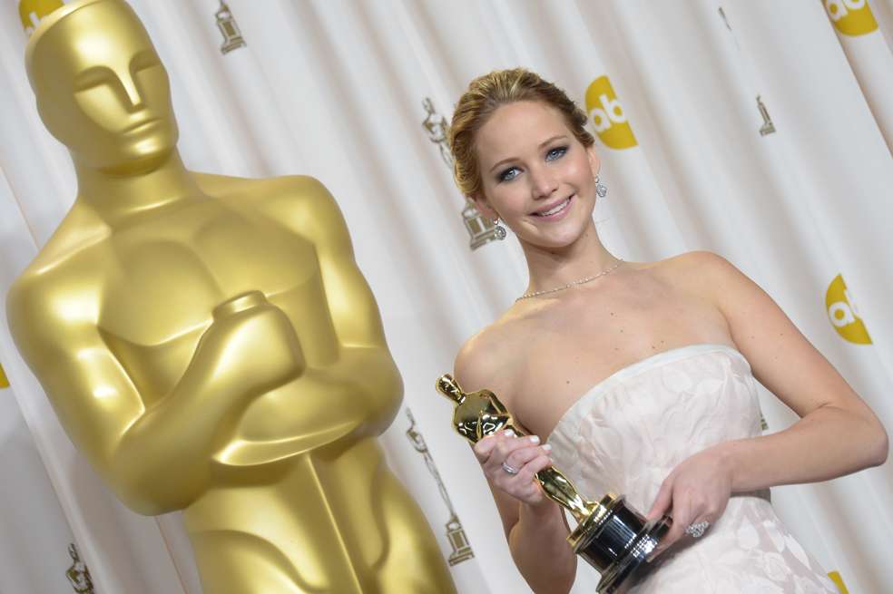 Jennifer Lawrence holds the trophy for Best Actress in the press room during the 85th Annual Academy Awards on February 24, 2013 in Hollywood, California. AFP PHOTO / JOE KLAMAR (Photo credit should read JOE KLAMAR/AFP/Getty Images)