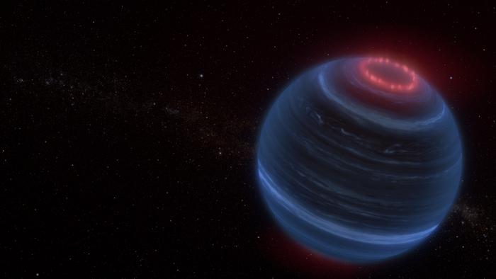 Esta es una ilustración de cómo se vería la estrella fallida. En rojo se observan las auroras generadas por las emisiones de metano.
