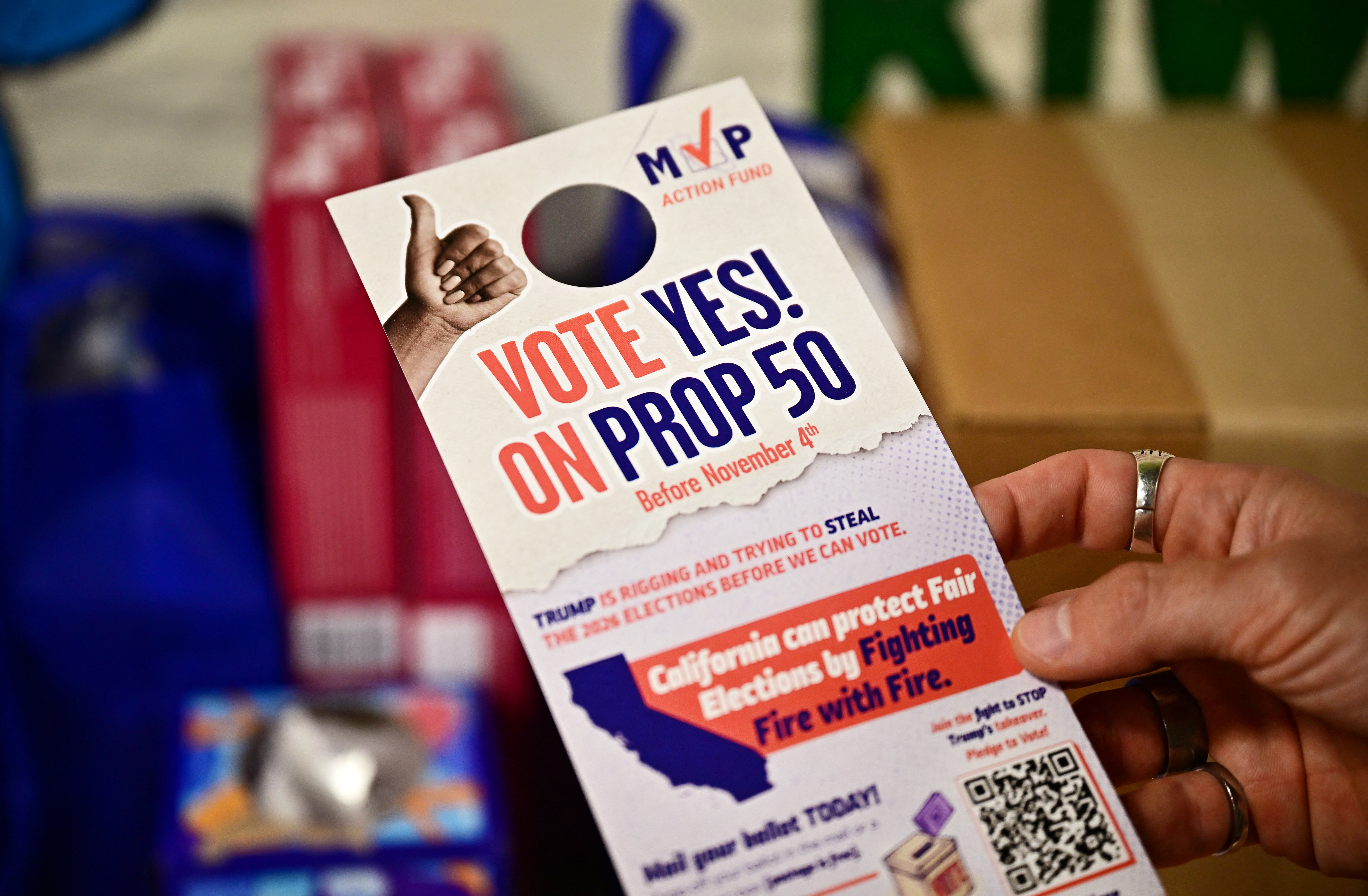 A Vote Yes on Prop 50 door hanger is displayed on October 22, 2025 in Koreatwon, Los Angeles, as volunteers canvass the neighborhood ahead of the November 4 election.