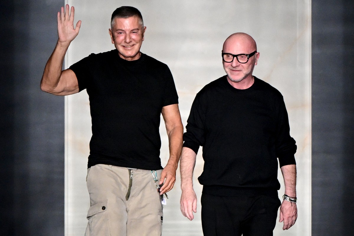 (FILES) Italian stylists Domenico Dolce (R) and Stefano Gabbana (L) salute the audience at the end of the Dolce & Gabbana women's ready-to-wear Fall/Winter 2026 collection show as part of the Milan Fashion Week, in Milan on February 28, 2026.