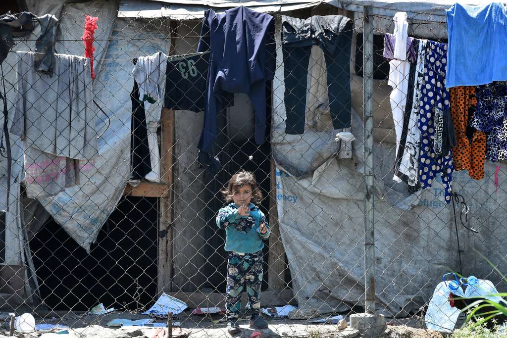 Bekaa (Lebanon), 22/06/2023.- A Syrian refugee child stands outside a makeshift shelter during a visit of a delegation of Members of the European Parliament to the Syrian refugee camp in Marj area at Bekaa Valley, Lebanon, 22 June 2023. The delegation's visit comes after a lot of controversy over the presence of Syrian refugees in Lebanon and calls by various Lebanese parties and politicians to return refugees to Syria or to transfer them to another country. The Lebanese Government estimates that Lebanon currently hosts approximately 1.5 million refugees from Syria, including approximately 815,000 registered with UNHCR. (Líbano, Siria) EFE/EPA/WAEL HAMZEH
