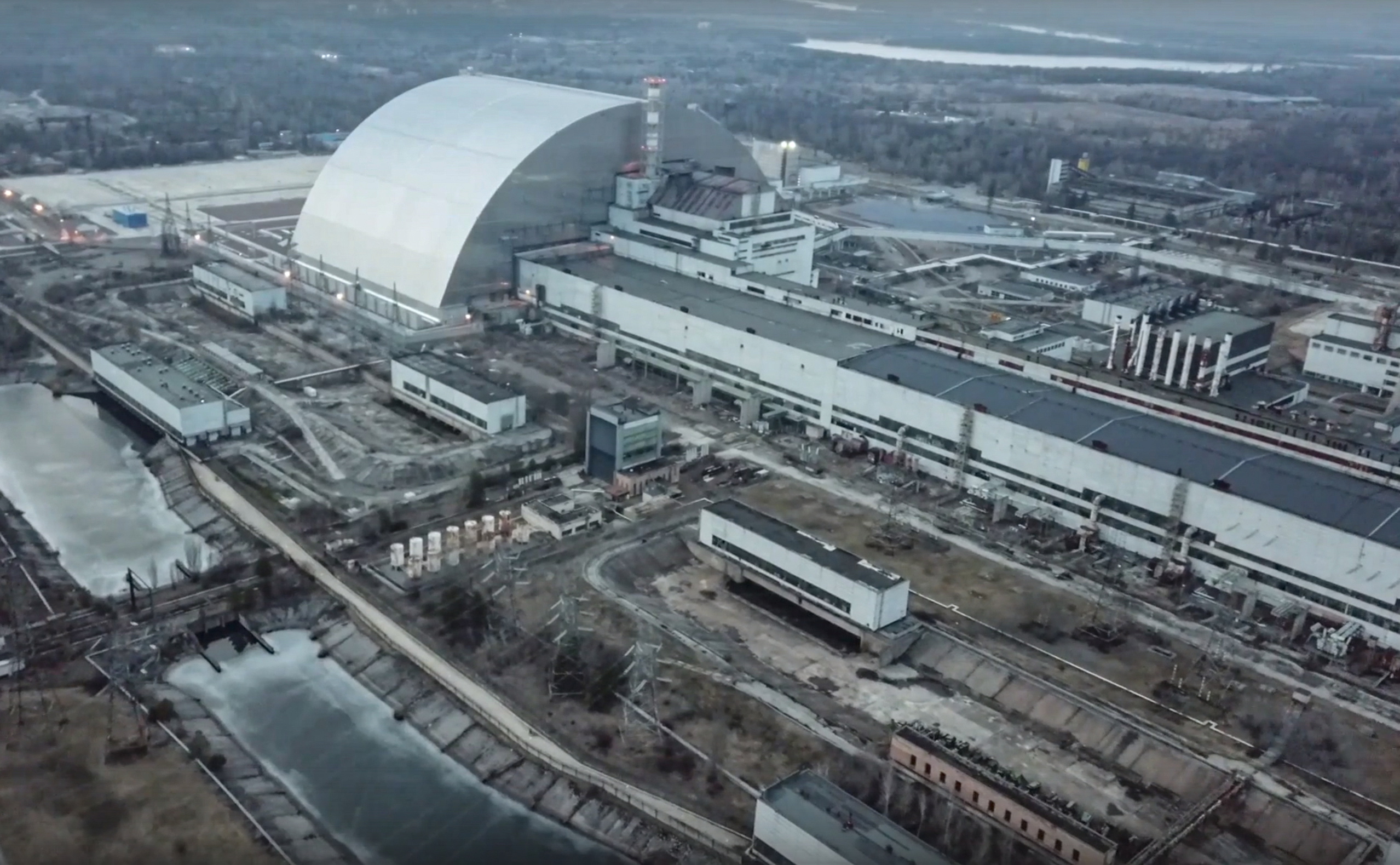 Pripyat (Ukraine), 07/03/2022.- (FILE) - A still image taken from a handout file video made available by the Russian Defence ministry press-service on 07 March 2022 shows a general view of the Chernobyl Nuclear Power Plant (NPP) in Pripyat, Ukraine (reissued 01 April 2022). According to a statement on the situation in Ukraine by the International Atomic Energy Agency (IAEA) Director General on 31 March, Ukraine informed the IAEA that Russian forces that seized control of the Chernobyl Nuclear Power Plant (NPP) since 24 February 'had, in writing, transferred control of the NPP to Ukrainian personnel and moved two convoys of troops towards Belarus'. (Bielorrusia, Rusia, Ucrania) EFE/EPA/RUSSIAN DEFENCE MINISTRY PRESS SERVICE HANDOUT -- BEST QUALITY AVAILABLE -- MANDATORY CREDIT: RUSSIAN DEFENCE MINISTRY PRESS SERVICE -- HANDOUT EDITORIAL USE ONLY/NO SALES