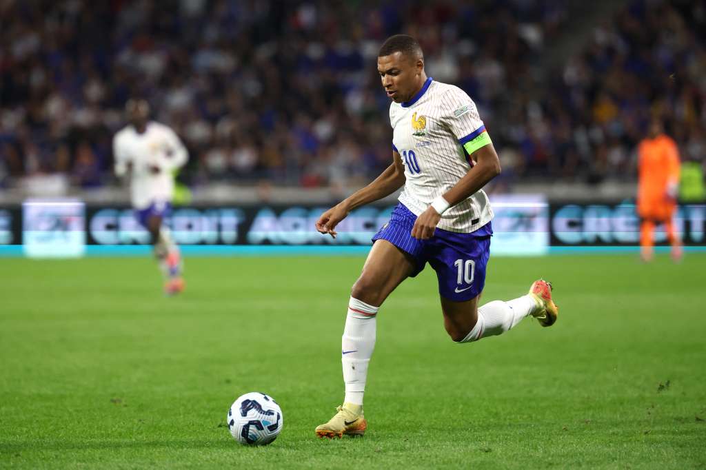 (FILES) France's forward #10 Kylian Mbappe runs with the ball during the UEFA Nations League, League A - Group 2 first leg football match between France and Belgium at the Parc Olympique Lyonnais in Lyon on September 9, 2024.