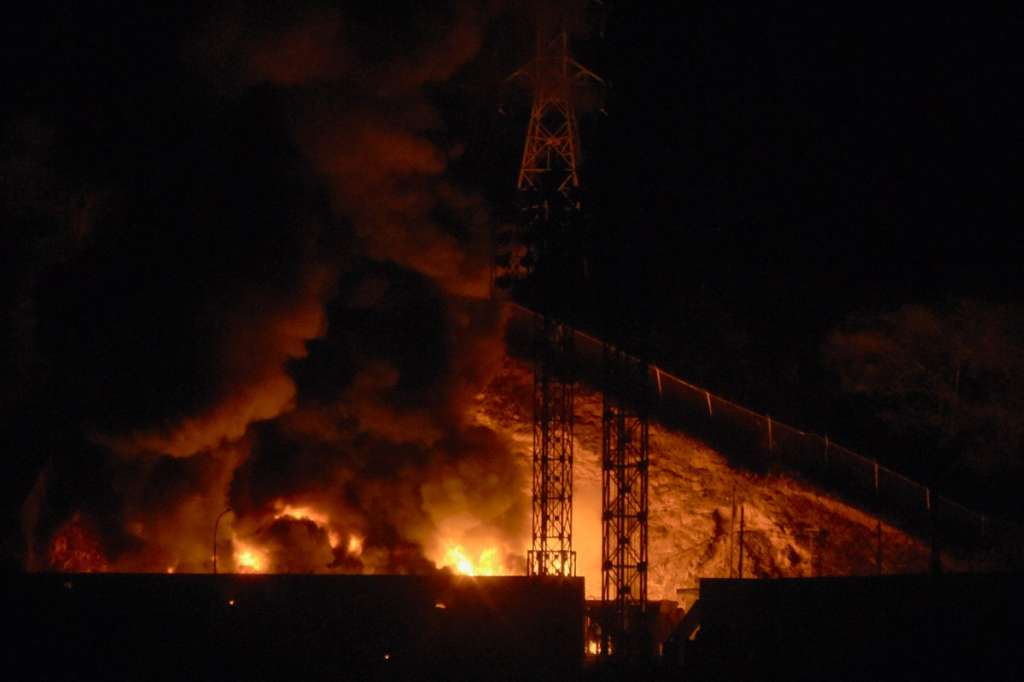 TOPSHOT - Picture of fire at Fuerte Tiuna, Venezuela's largest military complex, after a series of explosions in Caracas on January 3, 2026.