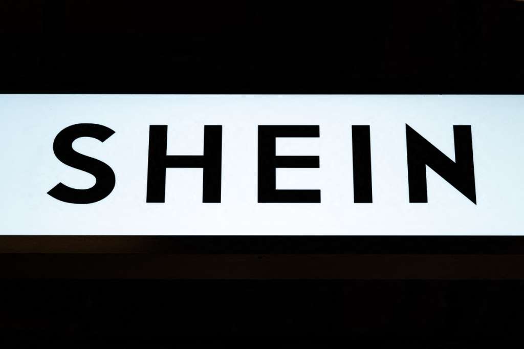 (FILES) This photograph shows the logo of Asian e-commerce giant Shein in its stall at the Bazar de l'Hotel de Ville (BHV) department store in Paris on November 4, 2025.
