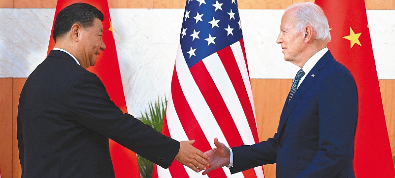 US President Joe Biden (R) and China's President Xi Jinping (L) shake hands as they meet on the sidelines of the G20 Summit in Nusa Dua on the Indonesian resort island of Bali on November 14, 2022.
(Photo by SAUL LOEB / AFP)