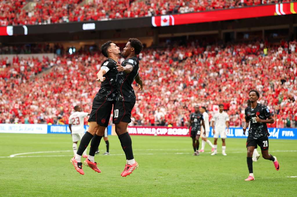 VANCOUVER, BRITISH COLUMBIA - JUNE 18: Jonathan David #10 of Canada celebrates with teammate Stephen Eustaquio #7 after scoring his team's third goal during the FIFA World Cup 2026 Group B match between Canada and Qatar at BC Place Vancouver on June 18, 2026 in Vancouver, British Columbia. Fran Santiago/Getty Images/AFP (Photo by Fran Santiago / GETTY IMAGES NORTH AMERICA / Getty Images via AFP)