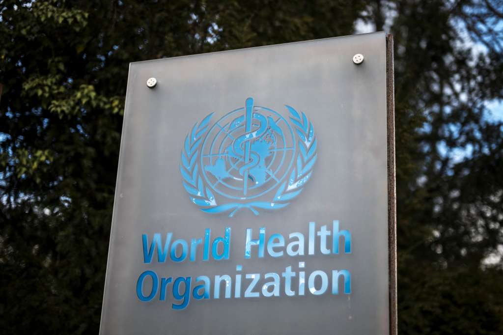 (FILES) This photograph shows a sign of the World Health Organization (WHO) displayed at their headquarters in Geneva on March 13, 2025.