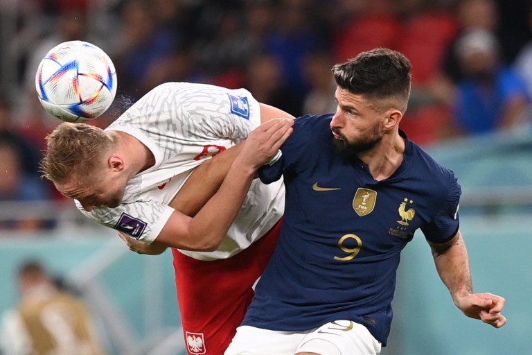 Doha (Qatar), 04/12/2022.- Olivier Giroud (R) of France in action against Kamil Glik of Poland during the FIFA World Cup 2022 round of 16 soccer match between France and Poland at Al Thumama Stadium in Doha, Qatar, 04 December 2022. (Mundial de Fútbol, Francia, Polonia, Catar) EFE/EPA/Georgi Licovski