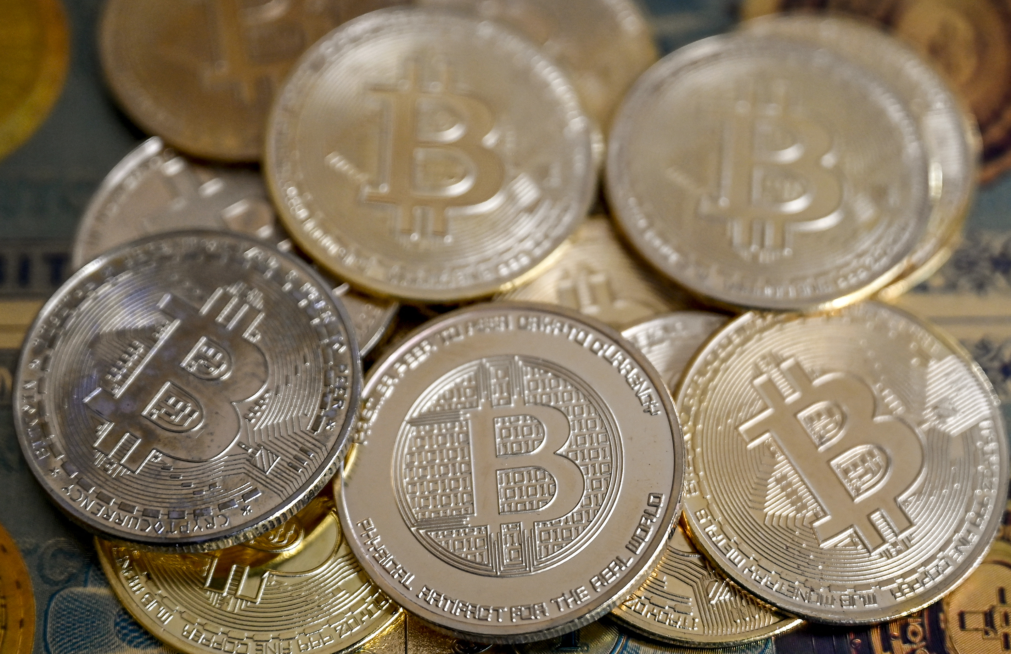 (FILES) This illustration photograph taken on November 22, 2024 in Istanbul shows coin imitations of Bitcoin.