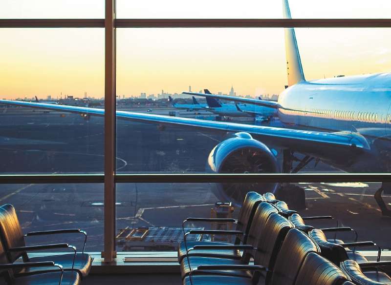 Airplane viewed through window at airport gate