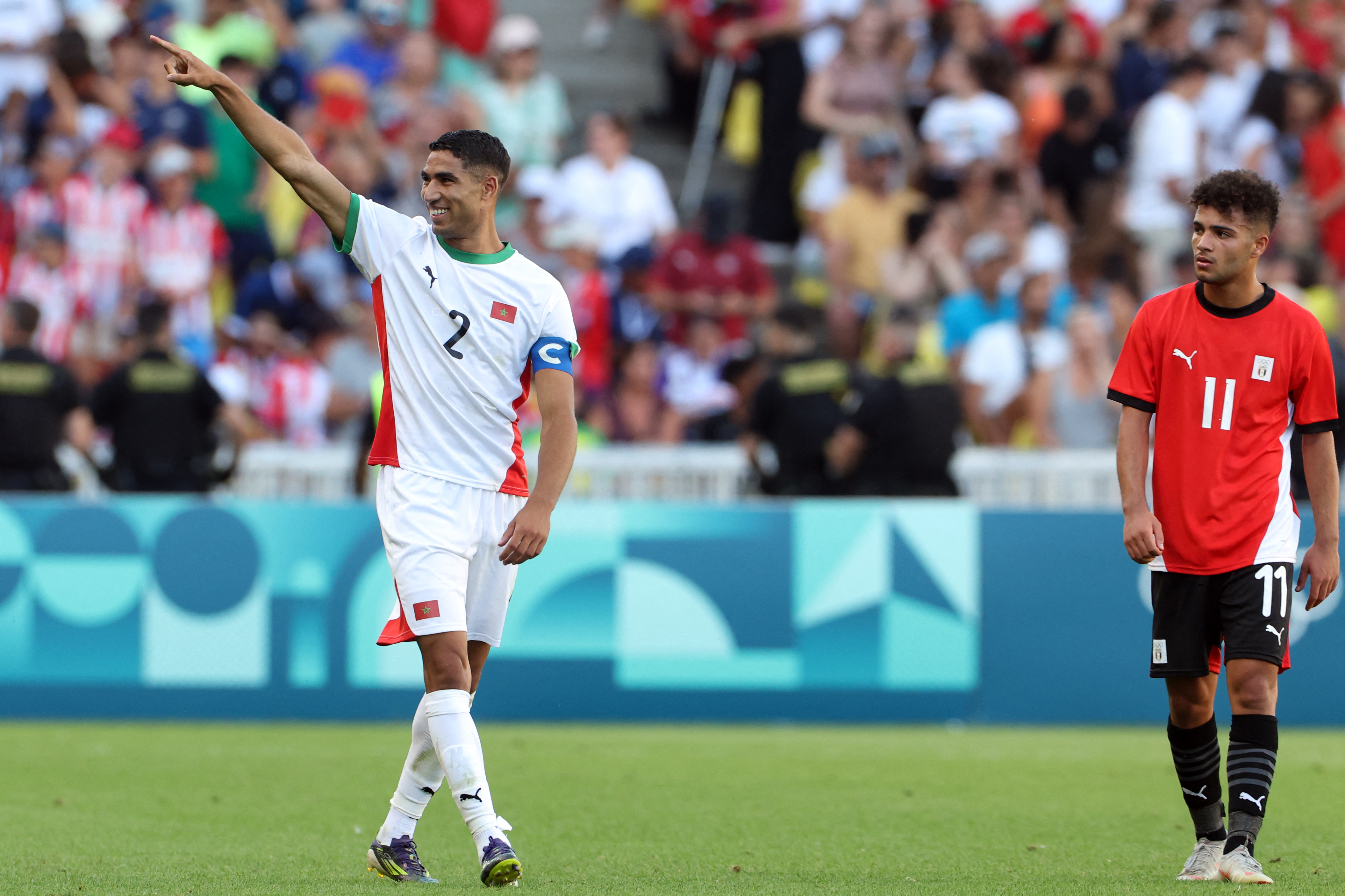 Morocco's defender #02 Achraf Hakimi celebrates scoring his team's sixth goal in the men's bronze medal football match between Egypt and Morocco during the Paris 2024 Olympic Games at the La Beaujoire Stadium in Nantes on August 8, 2024. (Photo by Alain JOCARD / AFP)