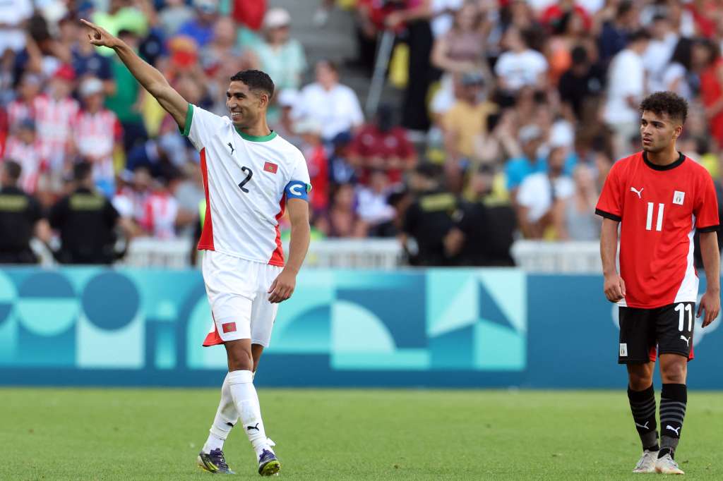 Morocco's defender #02 Achraf Hakimi celebrates scoring his team's sixth goal in the men's bronze medal football match between Egypt and Morocco during the Paris 2024 Olympic Games at the La Beaujoire Stadium in Nantes on August 8, 2024. (Photo by Alain JOCARD / AFP)