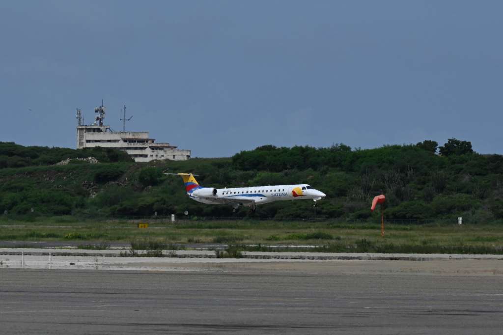 (FILES) A Satena Airlines aircraft covering the route Bogota-Caracas lands upon arrival at Simon Bolivar International Airport in Maiquetia, La Guaira State, Venezuela on November 9, 2022.