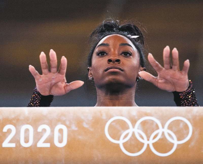 US gymnast Simone Biles prepares to practice on the balance beam during a training session at the Ariake Gymnastics Centre in Tokyo on July 22, 2021, on the eve of the start of the Tokyo 2020 Olympic Games. (Photo by Loic VENANCE / AFP)