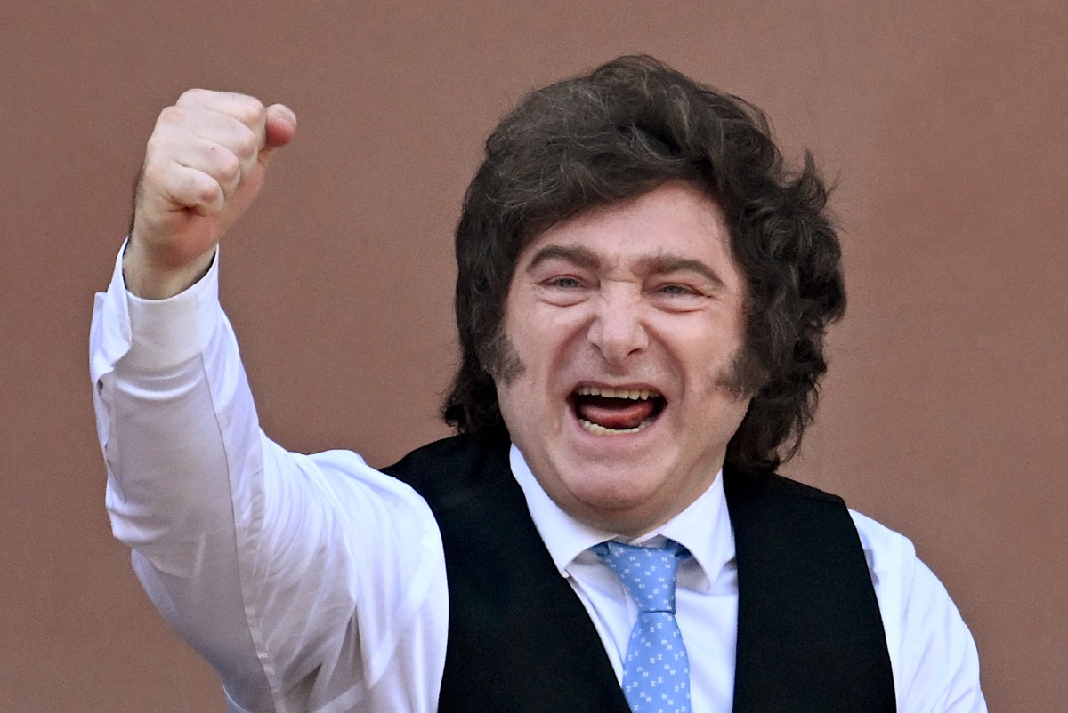 Argentina's President Javier Milei gestures from the balcony of Casa Rosada presidential palace after a Te Deum marking the 216th anniversary of the May Revolution that led to Argentina's independence from Spain, in Buenos Aires on May 25, 2026. (Photo by Luis ROBAYO / AFP)
