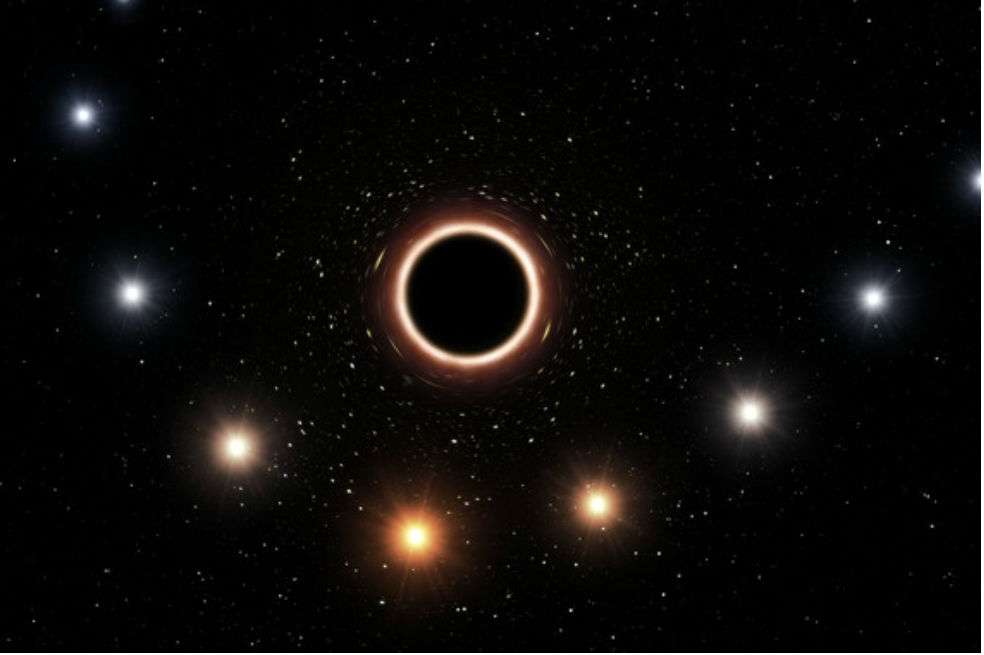 Ilustración de la trayectoria de la estrella S2 a medida que se acerca al agujero negro supermasivo del centro de la Vía Láctea. Cuando está muy cerca del agujero negro, el fuerte campo gravitatorio hace que el color de la estrella se desplace ligeramente hacia el rojo, un efecto de la teoría de la relatividad general de Einstein. (El gráfico se han exagerado tanto el efecto del color como el tamaño de los objetos para mayor claridad). / ESO/M. Kornmesser