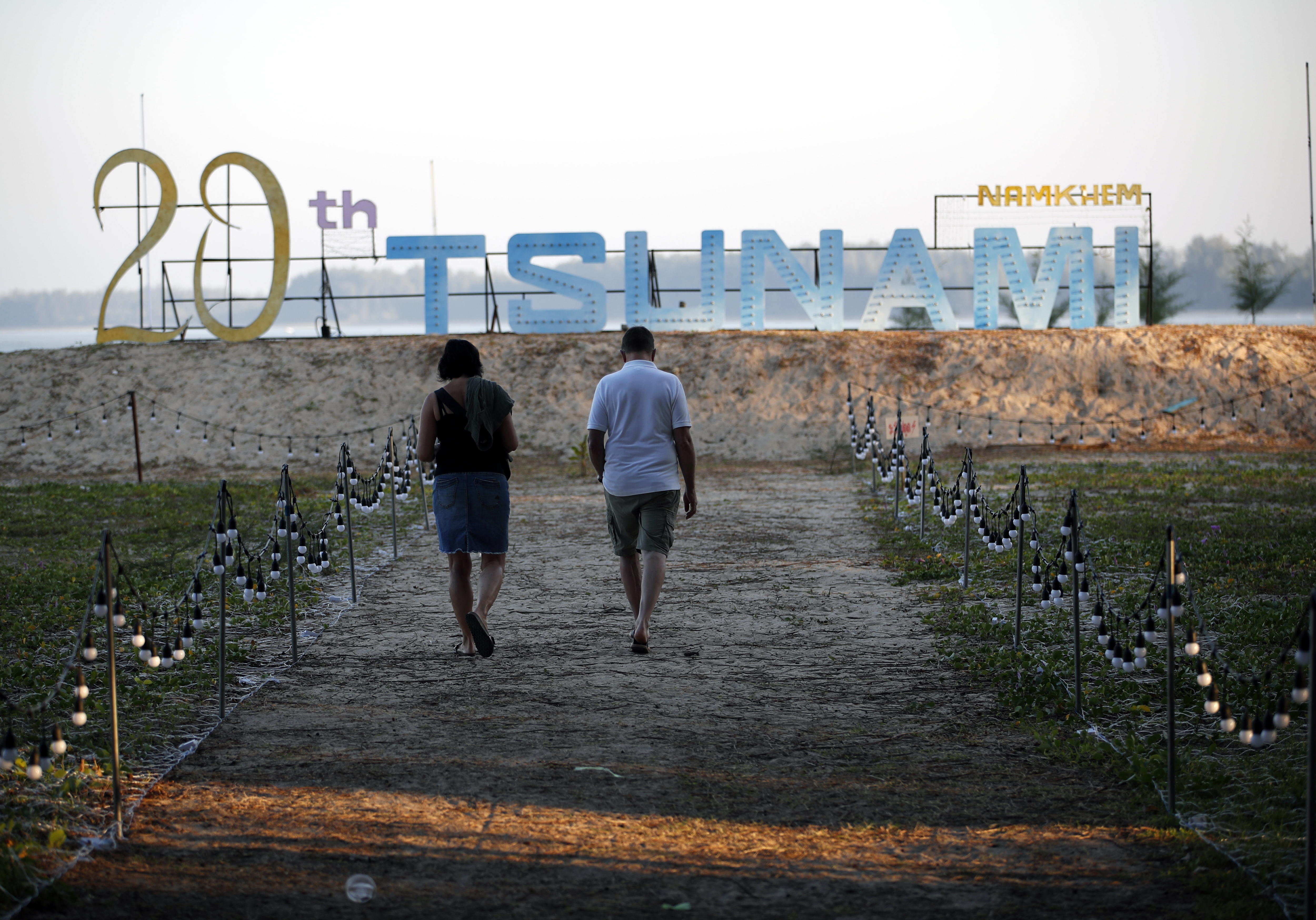 Takua Pa (Thailand), 26/12/2024.- German tsunami survivor from Aschaffenburg Claus Gerhart (R) and his wife visit a memorial park to commemorate the 20th anniversary of the 2004 tsunami at Tsunami Memorial Park in Ban Nam Khem, Phang Nga province, southern Thailand, 26 December 2024. Gerhart, 59, survived the 2004 tsunami, but he lost his youngest daughter and one friend in Thailand. Thailand commemorates the 20th anniversary of the 2004 Indian Ocean tsunami, which struck on 26 December 2004, triggered by a 9.2 magnitude earthquake in the Indian Ocean off the west coast of northern Sumatra, Indonesia. The tsunami claimed over 220,000 lives, internally displaced more than half a million people, and left hundreds of thousands without livelihoods, according to the United Nations, making it one of the deadliest natural disasters in history. Indonesia, Sri Lanka, India, the Maldives, and Thailand sustained massive damage from the catastrophe. (Terremoto/sismo, Maldivas, Tailandia) EFE/EPA/RUNGROJ YONGRIT